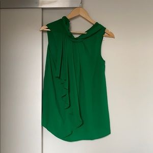 Green tank with ruffle accent